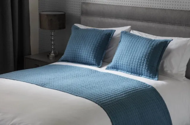 what is the exact function of the piece of fabric in hotel beds? 3955