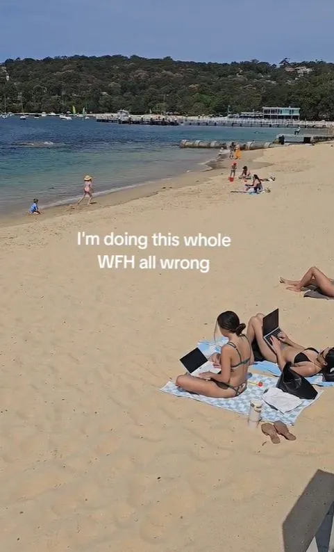 viral video of two women using laptops on a beach reignites the wfh debate 7462