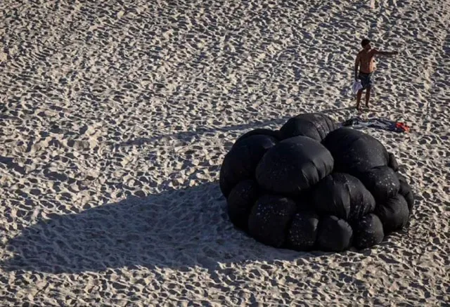 mysterious black balls found on sydney beaches sparked dark theories 7910