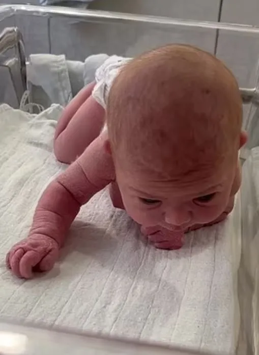 newborn stuns parents by attempting to crawl at just three days old 8886