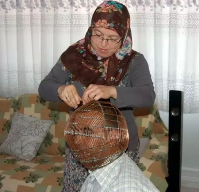 man locks his head in a massive cage and gives wife they key to quit smokin 9457