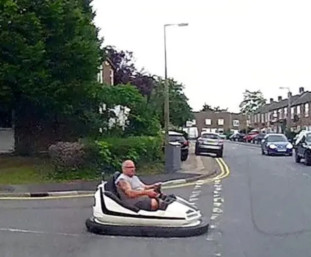 driver spotted on a public road behind the wheel of a fairground dodgem car 10632