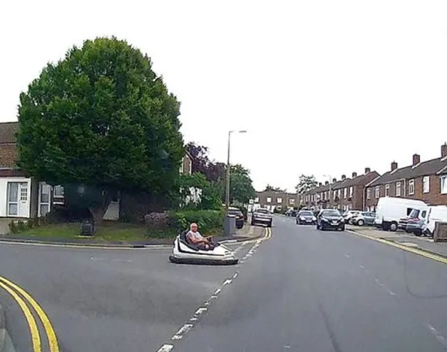 driver spotted on a public road behind the wheel of a fairground dodgem car 10635