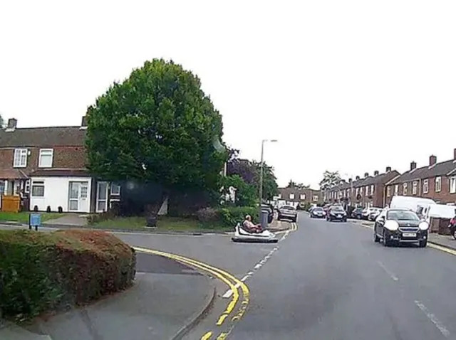 driver spotted on a public road behind the wheel of a fairground dodgem car 10636