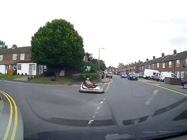 driver spotted on a public road behind the wheel of a fairground dodgem car 10634