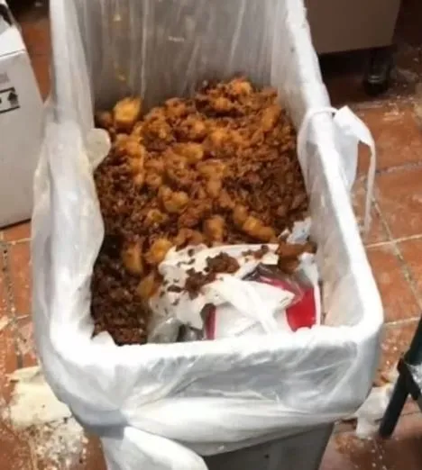 chick-fil-a employee throws away a full tray of chicken nuggets 11079