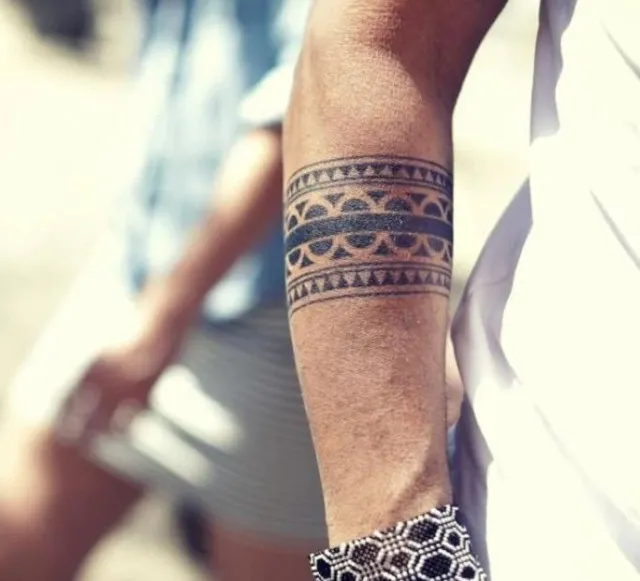 what does it mean when a man gets armband tattoos on his arm? 11179