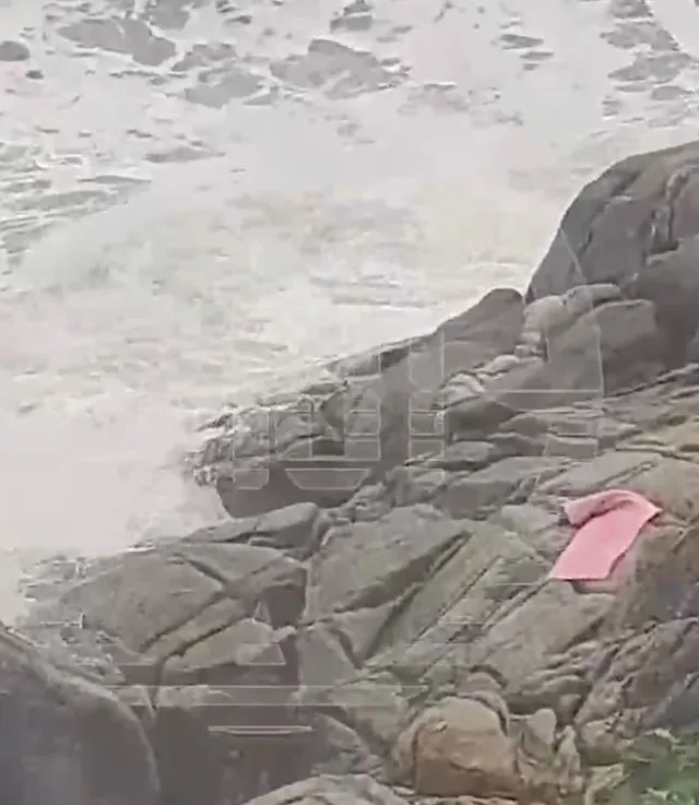 final moments of woman swept to sea while doing yoga on rocks. 11268