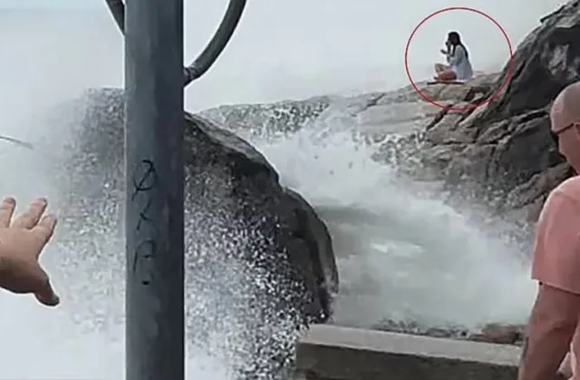 final moments of woman swept to sea while doing yoga on rocks. 11271