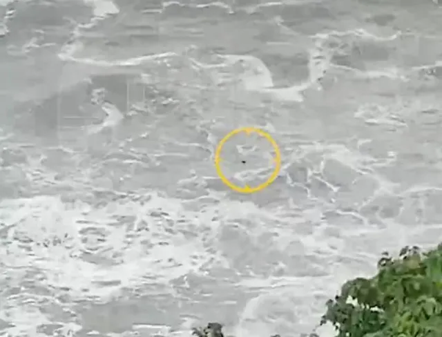 final moments of woman swept to sea while doing yoga on rocks. 11270