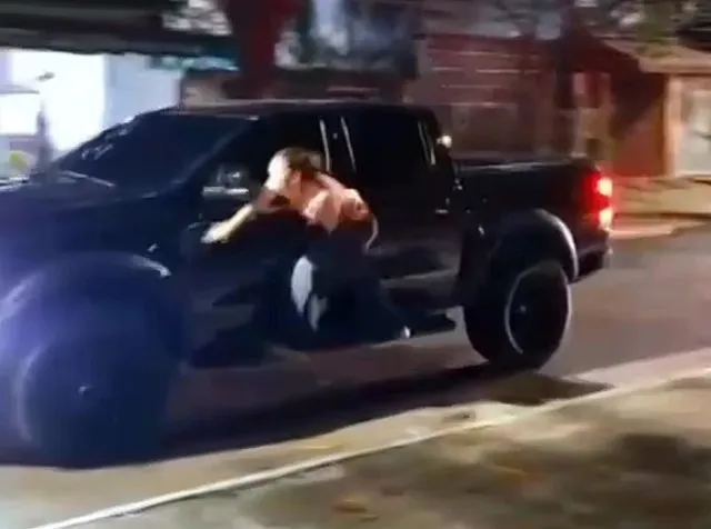 angry wife grabs onto moving pickup truck to hit husband after catching his 11908