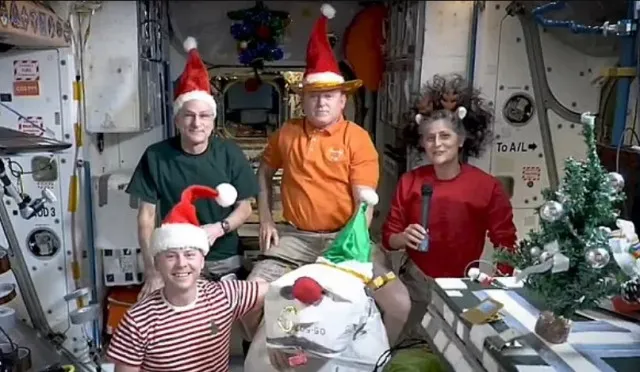 nasa stranded astronauts’ christmas photo in space raises debate about one 13330
