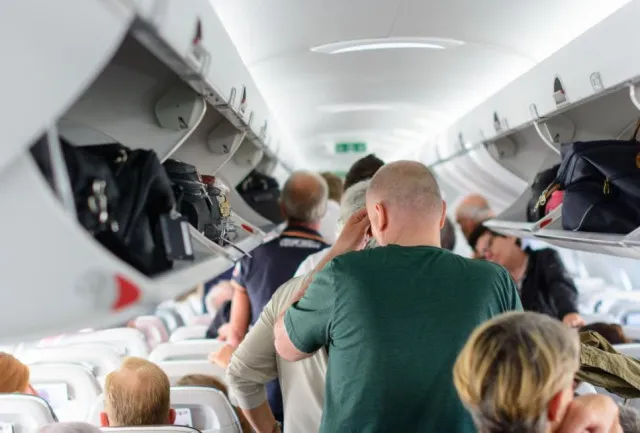 athlete made to hold strangers toddler on overbooked flight 13378