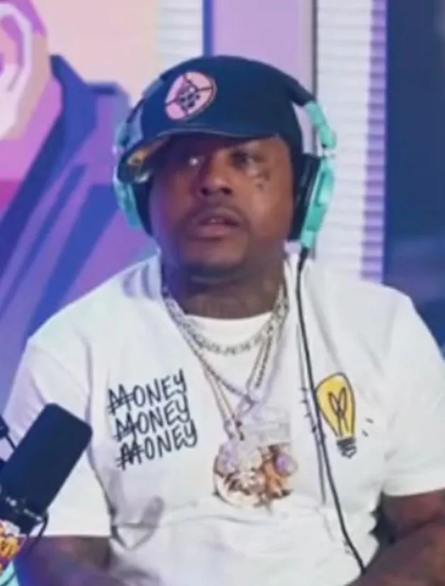 viewers stunned after rapper fires gun in pocket during live interview. 13919