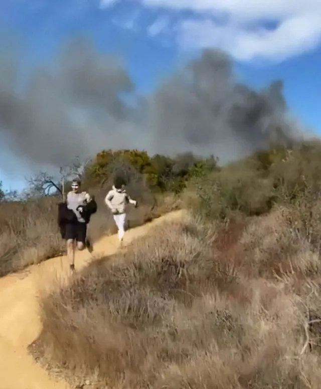 chilling video of young men fleeing la fire ignites speculation 15008