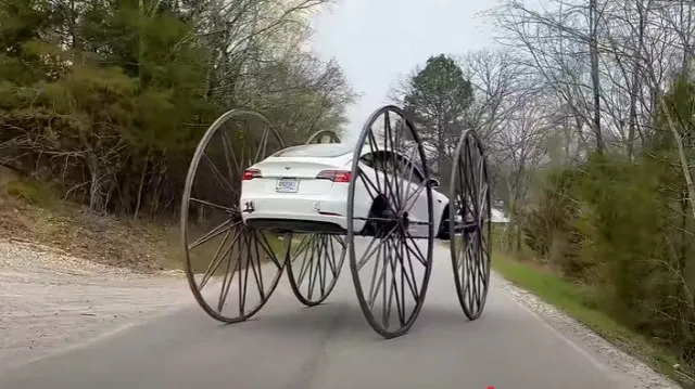 tesla owner causes a stir after adding giant 10-foot buggy wheels and drivi 14981