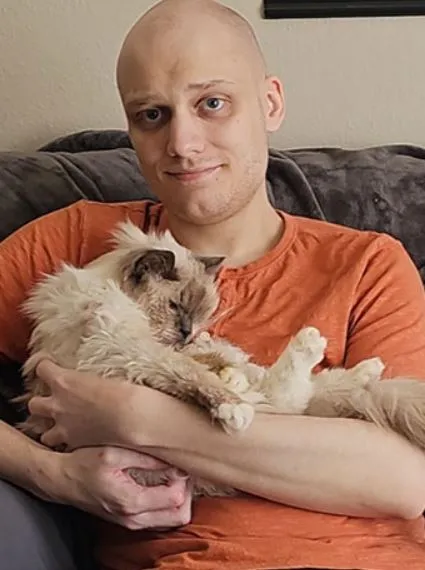 man moves tears as he recreates photo with childhood cat before saying good 16210