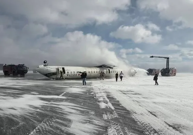 Footage shows Delta Airlines flight flipped upsidedown after crash