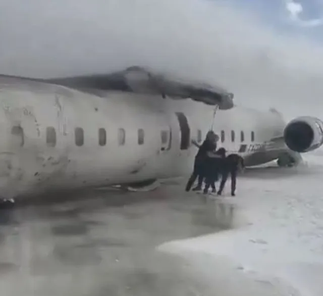Footage shows Delta Airlines flight flipped upsidedown after crash