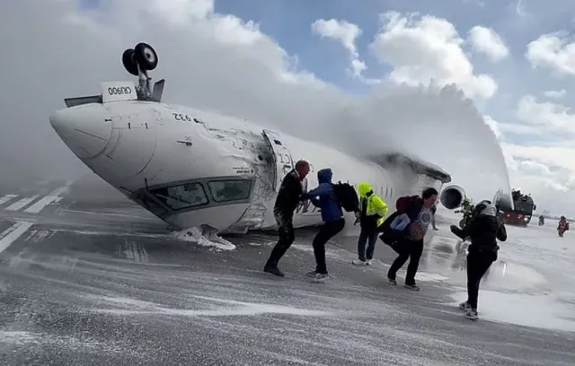 passenger captures moment of escape after delta plane flips on runway 17535
