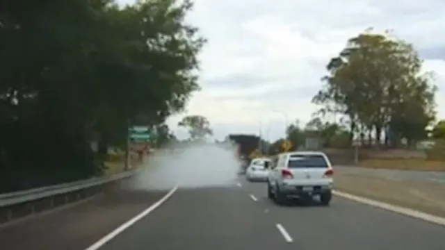 viewers baffled as car disappears in a cloud of smoke on the road while dri 17738
