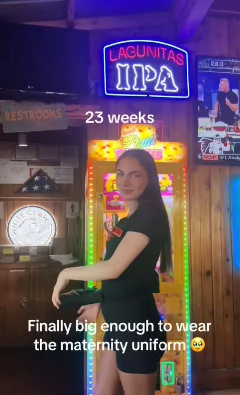 hooters server pray get a big tip as embraces maternity uniform while servi 18113