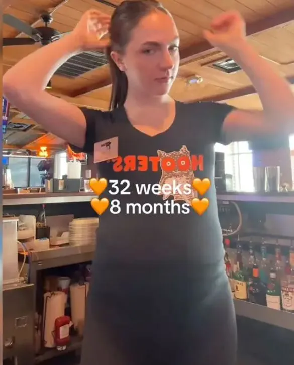 hooters server pray get a big tip as embraces maternity uniform while servi 18112