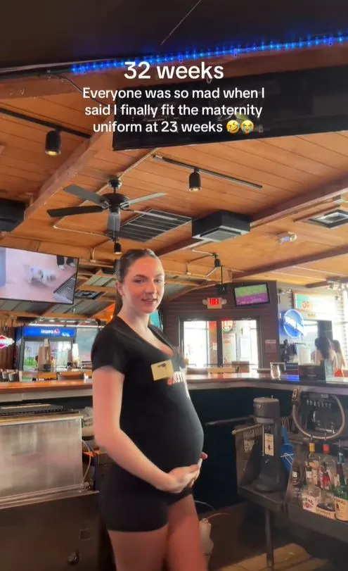hooters server pray get a big tip as embraces maternity uniform while servi 18110