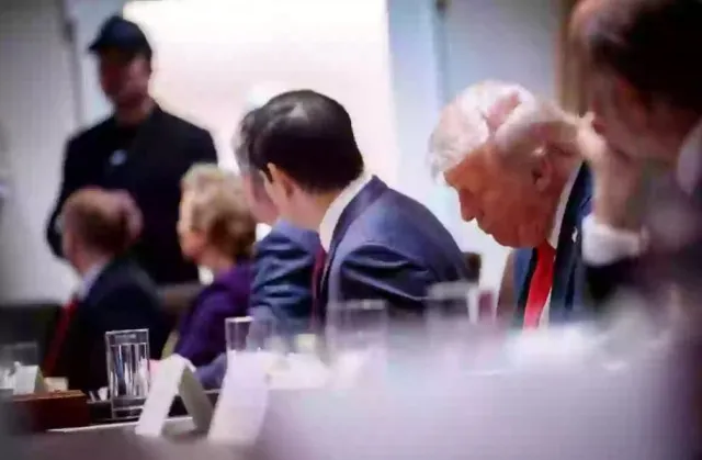 people point out one detail that stands out as donald trump holds his first 18239