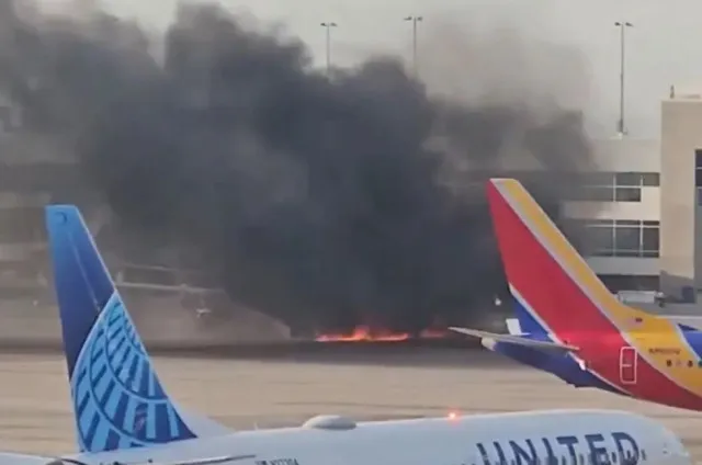 passengers stand on wing as they evacuate after plane bursts into flames at 19776
