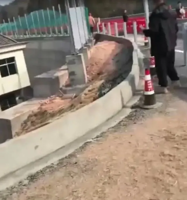 a determined homeowner in china refuses to relocate, forcing construction c 19871