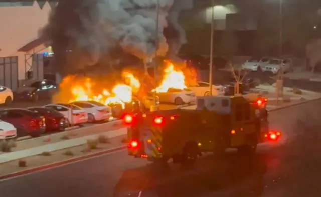 man arrested in molotov cocktail attack on tesla dealership also faces fede 20689