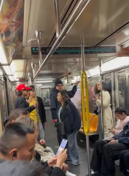 subway rider falls on camera after failed attempt to snatch maga hat 20735