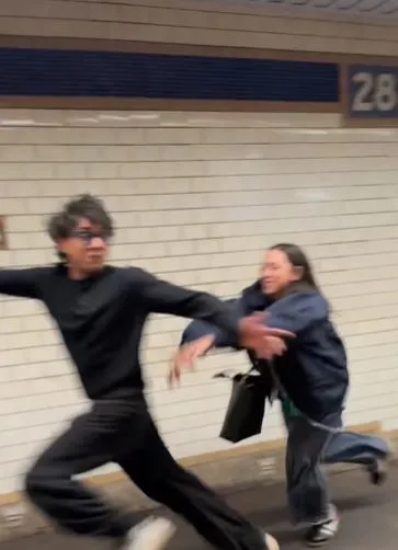 subway rider falls on camera after failed attempt to snatch maga hat 20736