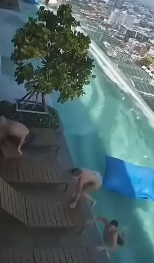 tourists scramble out of swaying infinity pool to avoid falling off skyscra 20967