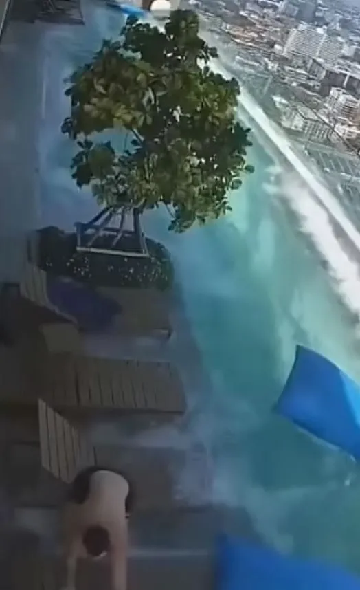 tourists scramble out of swaying infinity pool to avoid falling off skyscra 20969