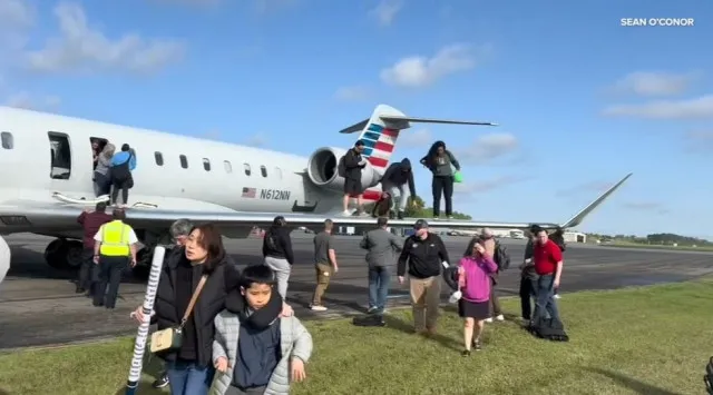 people stunned as video shows american airlines passengers evacuating plane 21303
