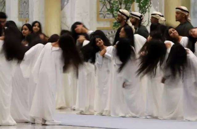 hair-flipping dancers and traditional rituals greet trump during uae visit 24240